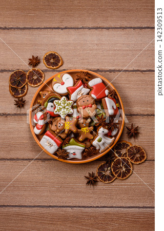 Gingerbread as a Christmas staple, sweet biscuits for the holiday. Gingerbread as a background 142309513