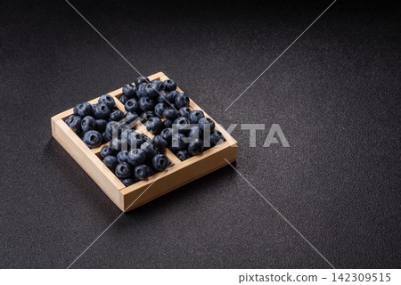 Fresh, ripe, and juicy wild blueberries as an ingredient for vegetarian dishes Fresh, ripe, and juicy wild blueberries as an ingredient for vegetarian dishes 142309515