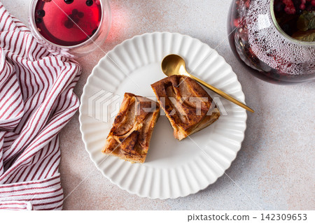 Delicious gluten free pear pie sits on a plate next to a berry drink. A bowl of pie is in the background. The scene is set for breakfast or lunch Delicious gluten free pear pie sits on a plate next to a berry drink. A bowl of pie is in the background. The scene is set for breakfast or lunch 142309653