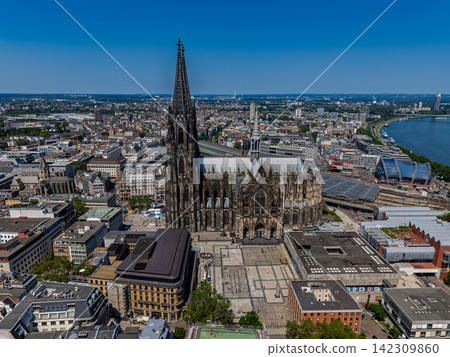 High angle wide horizontal aerial drone photograph of side view of Cologne Cathedral, Roncalliplatz square, Rhine River, and cityscape in Cologne, North Rhine-Westphalia, Germany on sunny summer day High angle wide horizontal aerial drone photograph of side view of Cologne Cathedral, Roncalliplatz square, Rhine River, and cityscape in Cologne, North Rhine-Westphalia, Germany on sunny summer day 142309860