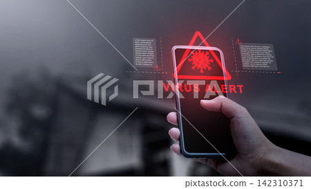 Hand holding a smartphone displaying a red holographic virus alert warning with cyber security notification. Concept of Technology Security Hand holding a smartphone displaying a red holographic virus alert warning with cyber security notification. Concept of Technology Security 142310371