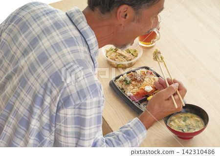 Middle-aged men with unhealthy eating habits Middle-aged men with unhealthy eating habits 142310486