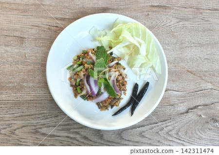 spicy crispy fried chop catfish meat with shallot and chili salad eat couple cabbage on plate spicy crispy fried chop catfish meat with shallot and chili salad eat couple cabbage on plate 142311474