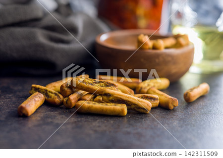 Golden Breadsticks Snack Pile With Olive Oil Bottle Closeup Rustic Savory Finger Food Appetizer Golden Breadsticks Snack Pile With Olive Oil Bottle Closeup Rustic Savory Finger Food Appetizer 142311509