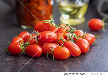 Fresh Cherry Tomatoes on Rustic Wooden Table Close-Up, Red Organic Produce and Healthy Snack Fresh Cherry Tomatoes on Rustic Wooden Table Close-Up, Red Organic Produce and Healthy Snack 142311512