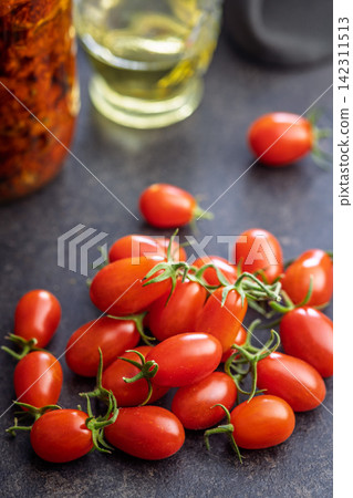 Fresh Cherry Tomatoes on Rustic Wooden Table Close-Up, Red Organic Produce and Healthy Snack Fresh Cherry Tomatoes on Rustic Wooden Table Close-Up, Red Organic Produce and Healthy Snack 142311513
