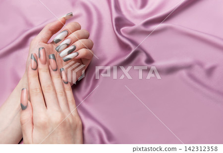 Woman hands showing elegant long manicure nail art 142312358
