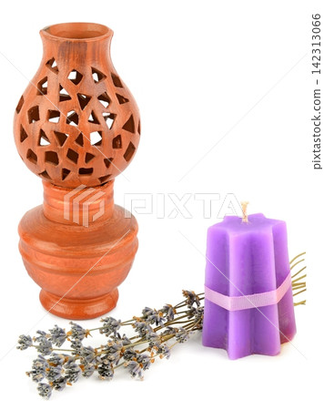 Clay Aroma Lamp with Purple Candle and Dried Lavender Isolated on White Spa Aromatherapy Still Life with Terracotta Oil Burner and Lavender Sprigs Clay Aroma Lamp with Purple Candle and Dried Lavender Isolated on White Spa Aromatherapy Still Life with Terracotta Oil Burner and Lavender Sprigs 142313066