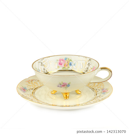 Vintage Porcelain Teacup and Saucer with Floral Pattern Isolated on White Elegant Antique China Teacup with Gold Legs and Gilded Details Vintage Porcelain Teacup and Saucer with Floral Pattern Isolated on White Elegant Antique China Teacup with Gold Legs and Gilded Details 142313070
