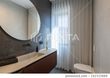 Bathroom interior arranged with vanity and toilet in contemporary design Bathroom interior arranged with vanity and toilet in contemporary design 142315669
