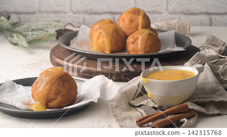 Sonhos de Natal Traditional Portuguese Fried Dough with Egg Cream Sonhos de Natal Traditional Portuguese Fried Dough with Egg Cream 142315768
