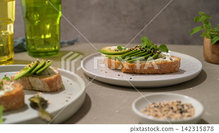 Toast with avocado cream cheese and wheat bread Toast with avocado cream cheese and wheat bread 142315878