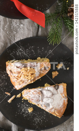 Two slices of Bolo Rainha cake dusted with powdered sugar Two slices of Bolo Rainha cake dusted with powdered sugar 142315888