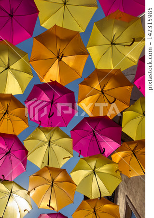 Bright hanging umbrellas against a clear blue sky Bright hanging umbrellas against a clear blue sky 142315985