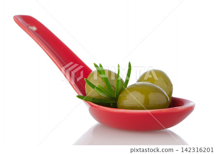 Olives on ceramic spoon Olives on ceramic spoon 142316201