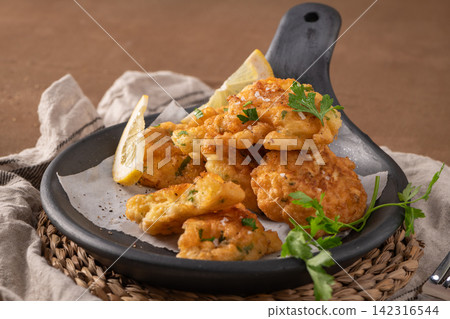 Golden Cod Fish Fritters with Lemon and Parsley Golden Cod Fish Fritters with Lemon and Parsley 142316544