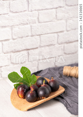 Fresh Black Mission Figs on a Plate Fresh Black Mission Figs on a Plate 142316665