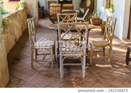 Rustic Mediterranean terrace dining area in historic countryside residence Rustic Mediterranean terrace dining area in historic countryside residence 142316875