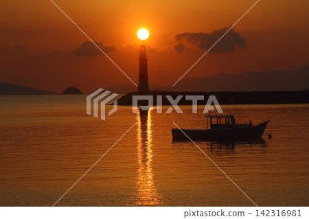 Seascape at sunshine. Lighthouse and sailings on the coast. Seaside town of Turgutreis and spectacular sunshine Seascape at sunshine. Lighthouse and sailings on the coast. Seaside town of Turgutreis and spectacular sunshine 142316981