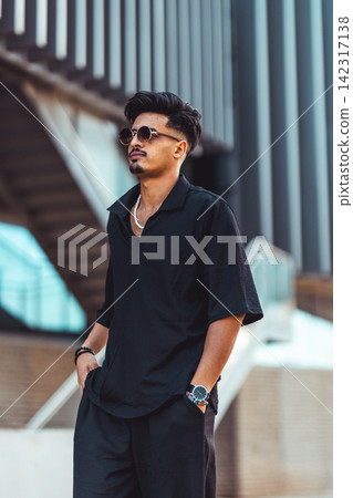 Moroccan man wearing sunglasses and black clothing Moroccan man wearing sunglasses and black clothing 142317138
