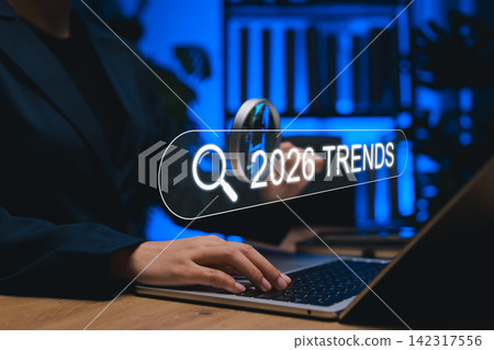 Future business and technology concept. Person use laptop and magnifying glass with search bar reading 2026 Trends, symbolizing innovation, digital transformation, forecasting future market directions Future business and technology concept. Person use laptop and magnifying glass with search bar reading 2026 Trends, symbolizing innovation, digital transformation, forecasting future market directions 142317556