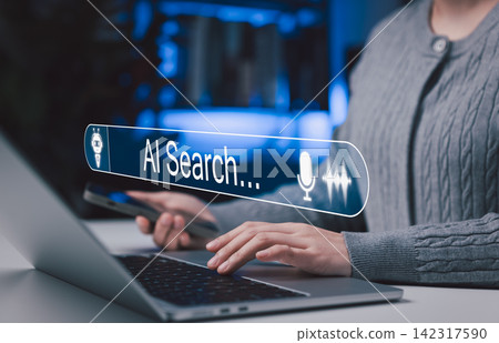 AI search and voice assistant technology concept. Person using laptop and smartphone with virtual search bar, representing artificial intelligence, voice recognition, chatbot, smart search innovation AI search and voice assistant technology concept. Person using laptop and smartphone with virtual search bar, representing artificial intelligence, voice recognition, chatbot, smart search innovation 142317590