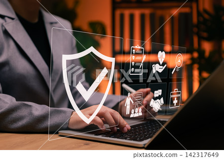 Work safety concept. Businesswoman using laptop with icons for workplace safety, health checklist, risk management, and compliance. Perfect for occupational safety, corporate policy and training. Work safety concept. Businesswoman using laptop with icons for workplace safety, health checklist, risk management, and compliance. Perfect for occupational safety, corporate policy and training. 142317649