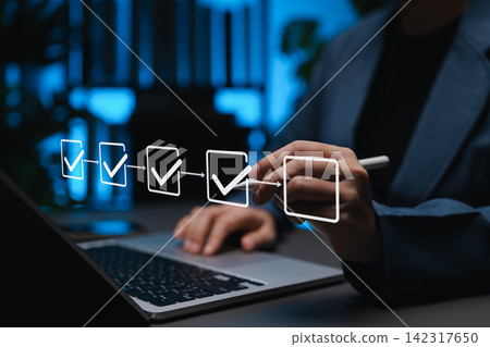 Project planning and workflow management concept. Person using laptop with virtual checklist and progress icons, represent task tracking, business process automation, efficient step-by-step execution Project planning and workflow management concept. Person using laptop with virtual checklist and progress icons, represent task tracking, business process automation, efficient step-by-step execution 142317650