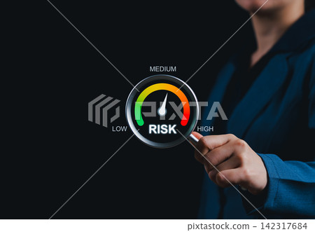Risk assessment concept. Businesswoman holding gauge meter with risk level indicator, symbolizing risk management, financial analysis, strategic decision-making, business uncertainty evaluation, Risk assessment concept. Businesswoman holding gauge meter with risk level indicator, symbolizing risk management, financial analysis, strategic decision-making, business uncertainty evaluation, 142317684