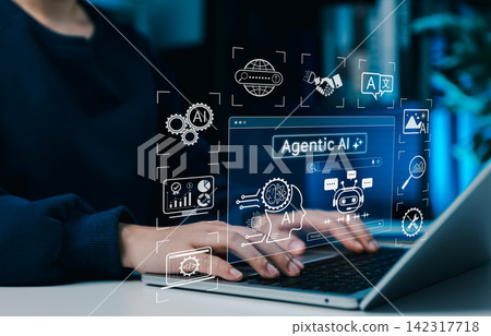 Agentic AI technology concept. Woman using laptop with artificial intelligence interface, machine learning, automation tools, data analysis and smart autonomous systems for next-gen digital innovation Agentic AI technology concept. Woman using laptop with artificial intelligence interface, machine learning, automation tools, data analysis and smart autonomous systems for next-gen digital innovation 142317718