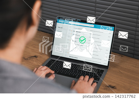 Verified email communication and digital messaging concept. Woman using laptop with multiple email icons and confirmed email symbol, representing secure email access, inbox management, data protection Verified email communication and digital messaging concept. Woman using laptop with multiple email icons and confirmed email symbol, representing secure email access, inbox management, data protection 142317762
