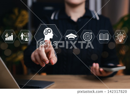 Concept of professional skills development and digital learning. Business professional touching skills interface representing education, career growth, knowledge, training and goal achievement. 142317820