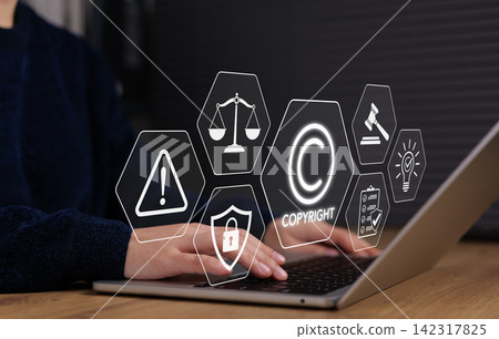 Copyright protection concept. Person using laptop with intellectual property icon representing legal compliance, content ownership rights, digital security, trademark law and creative asset protection Copyright protection concept. Person using laptop with intellectual property icon representing legal compliance, content ownership rights, digital security, trademark law and creative asset protection 142317825