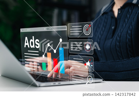 Digital Marketing and Online Advertising Strategy Concept. A person using laptop with advertising icons, performance metrics, audience targeting, and campaign strategy analytics for online marketing. Digital Marketing and Online Advertising Strategy Concept. A person using laptop with advertising icons, performance metrics, audience targeting, and campaign strategy analytics for online marketing. 142317842