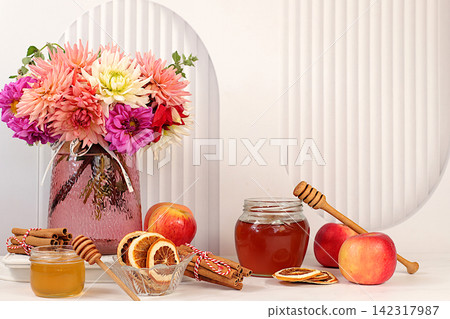 Autumn banner with a beautiful bouquet of dahlias in a vase, honey, apples, dried orange, cinnamon and star anise on an elegant background, autumn greeting and gratitude concept, cozy composition Autumn banner with a beautiful bouquet of dahlias in a vase, honey, apples, dried orange, cinnamon and star anise on an elegant background, autumn greeting and gratitude concept, cozy composition 142317987