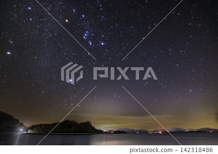 Winter starry sky over the Seto Inland Sea: The rising constellation Orion and the Winter Triangle Winter starry sky over the Seto Inland Sea: The rising constellation Orion and the Winter Triangle 142318486
