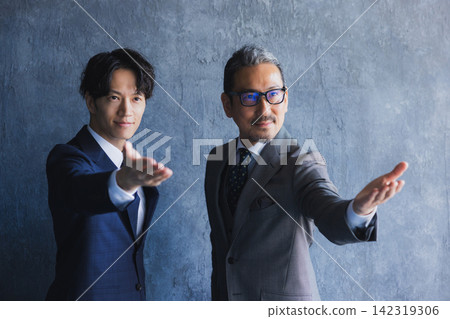 Smiling businessmen standing side by side Smiling businessmen standing side by side 142319306