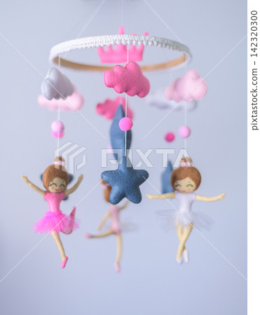 A charming handmade nursery cot mobile with pink and blue ballerina dolls, fluffy clouds, stars, moons, and soft hanging decorations A charming handmade nursery cot mobile with pink and blue ballerina dolls, fluffy clouds, stars, moons, and soft hanging decorations 142320300