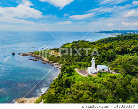 A clear summer morning, aerial photograph of Kannonzaki Lighthouse taken from 145 meters above the sea side of Kannonzaki, with Tokyo Bay in the background. A clear summer morning, aerial photograph of Kannonzaki Lighthouse taken from 145 meters above the sea side of Kannonzaki, with Tokyo Bay in the background. 142320337