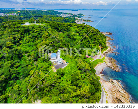 A clear summer morning, aerial photograph of Kannonzaki Lighthouse taken from 145 meters above the sea side of Kannonzaki, with Tokyo Bay in the background. A clear summer morning, aerial photograph of Kannonzaki Lighthouse taken from 145 meters above the sea side of Kannonzaki, with Tokyo Bay in the background. 142320339