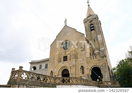 Facade of Our Lady of Penha Chapel originally built in 1622 and completely reconstructed in 1935 under a cloudy sky. Facade of Our Lady of Penha Chapel originally built in 1622 and completely reconstructed in 1935 under a cloudy sky. 142320587