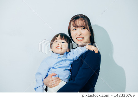 A mother holding a child A mother holding a child 142320769