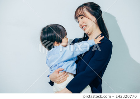 A mother holding a child A mother holding a child 142320770