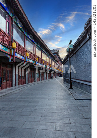 perspective view of a traditional Chinese street with wooden buildings and stone pavement 142321203