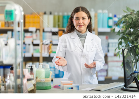 Portrait of pharmacist girl inviting to visit modern drugstore Portrait of pharmacist girl inviting to visit modern drugstore 142321414