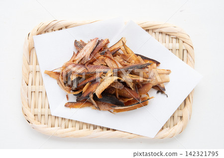 Thickly shaved bonito flakes placed on a sieve Thickly shaved bonito flakes placed on a sieve 142321795