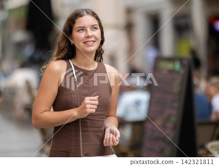 Young woman walking around summer european city Young woman walking around summer european city 142321811