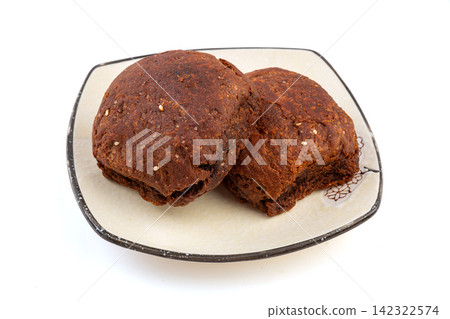 chinese traditional brown sugar and sesame paste baked flatbread served on white background chinese traditional brown sugar and sesame paste baked flatbread served on white background 142322574