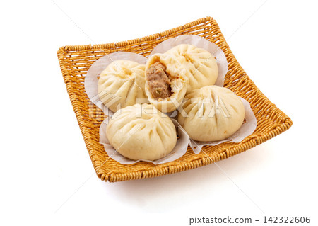 traditional Tianjin style steamed pork stuffed buns served on basket traditional Tianjin style steamed pork stuffed buns served on basket 142322606