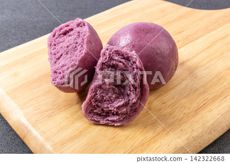 handmade purple sweet potato steamed mantou bun split open on board handmade purple sweet potato steamed mantou bun split open on board 142322668